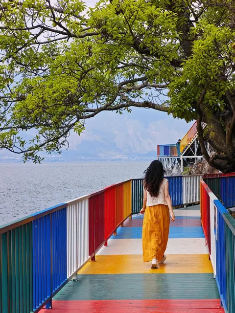 A rainbow-painted boardwalk along the lake on Nanzhao Fengqing Island